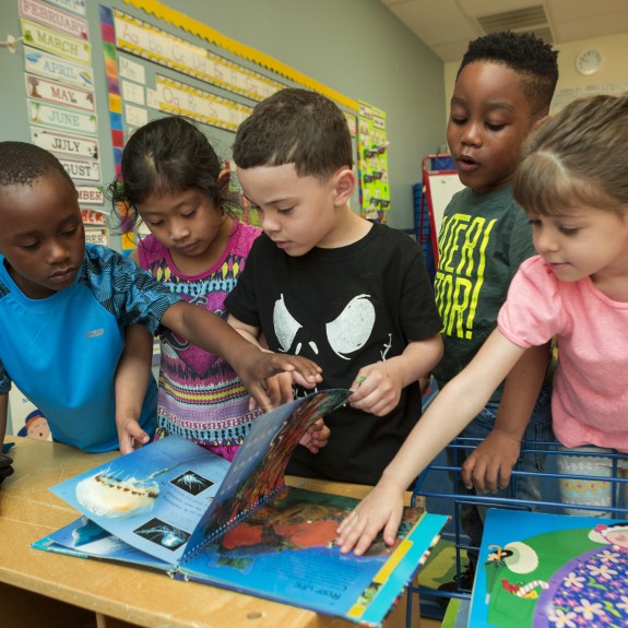 Children with book.